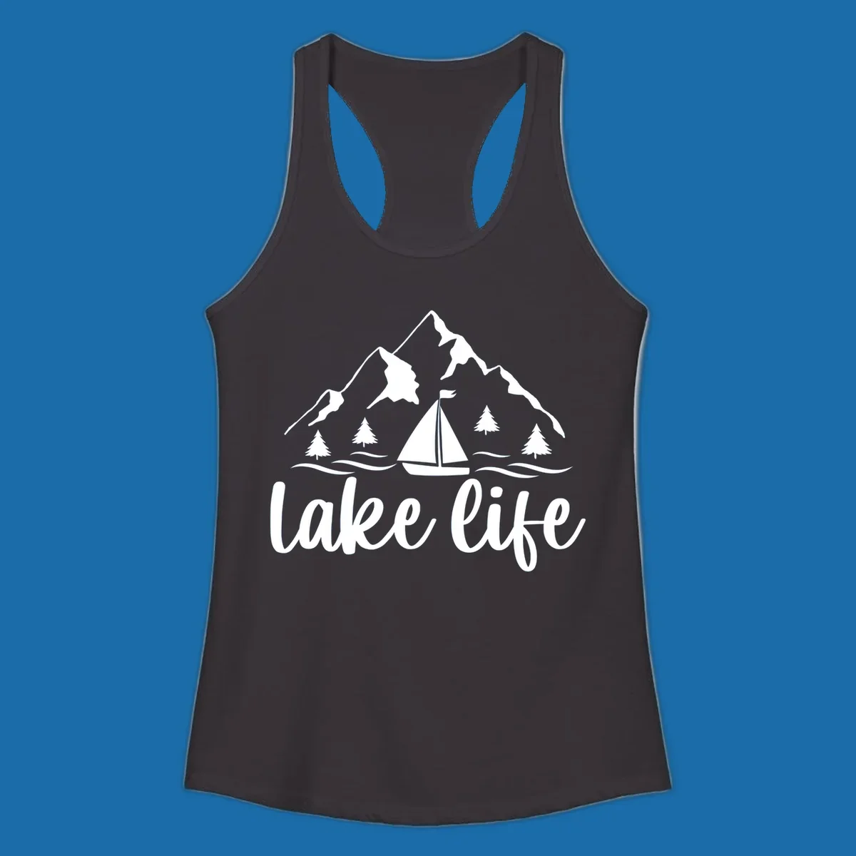 Lake life mountain sailboat scenic design with mountains, trees, sailboat, and text.