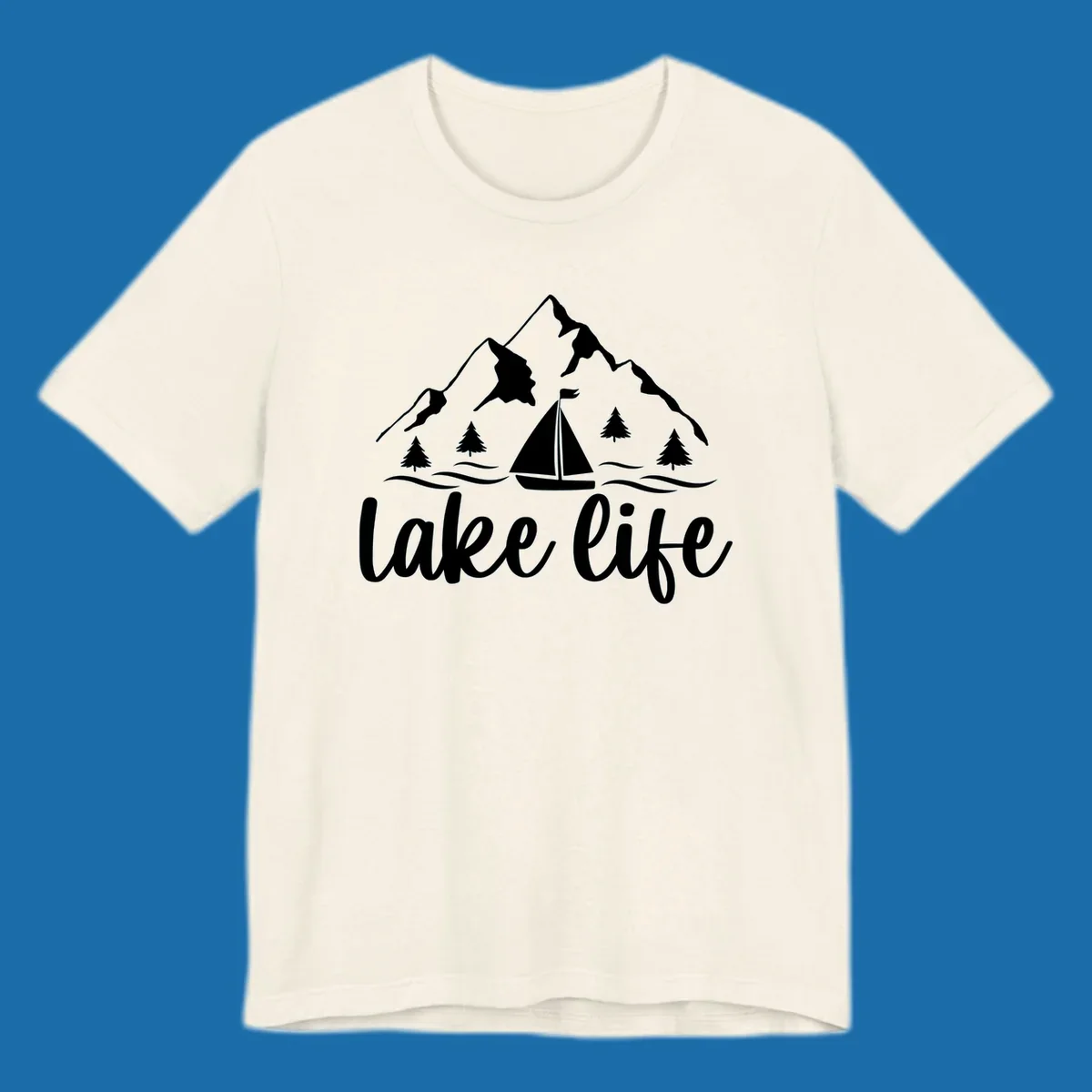 Lake life mountain sailboat scenic design with mountains, trees, sailboat, and text.