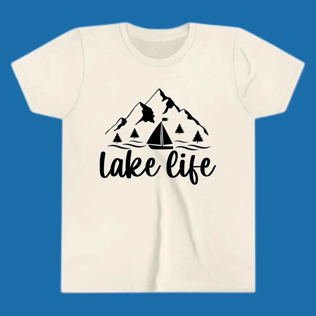 Lake life mountain sailboat scenic design with mountains, trees, sailboat, and text.