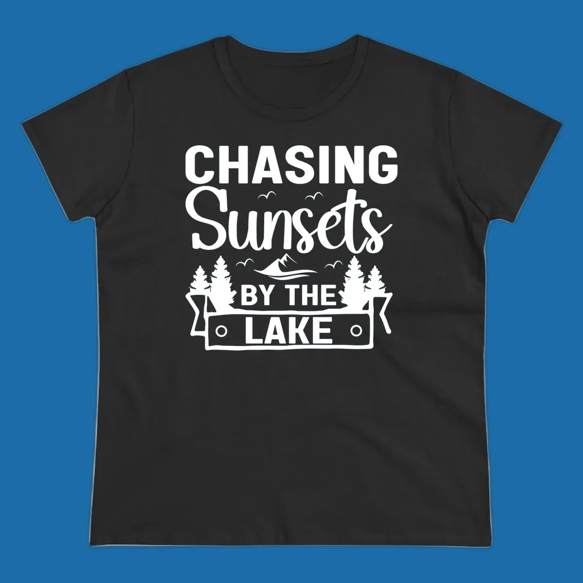 Chasing sunsets by the lake design with text, trees, mountains, and birds.