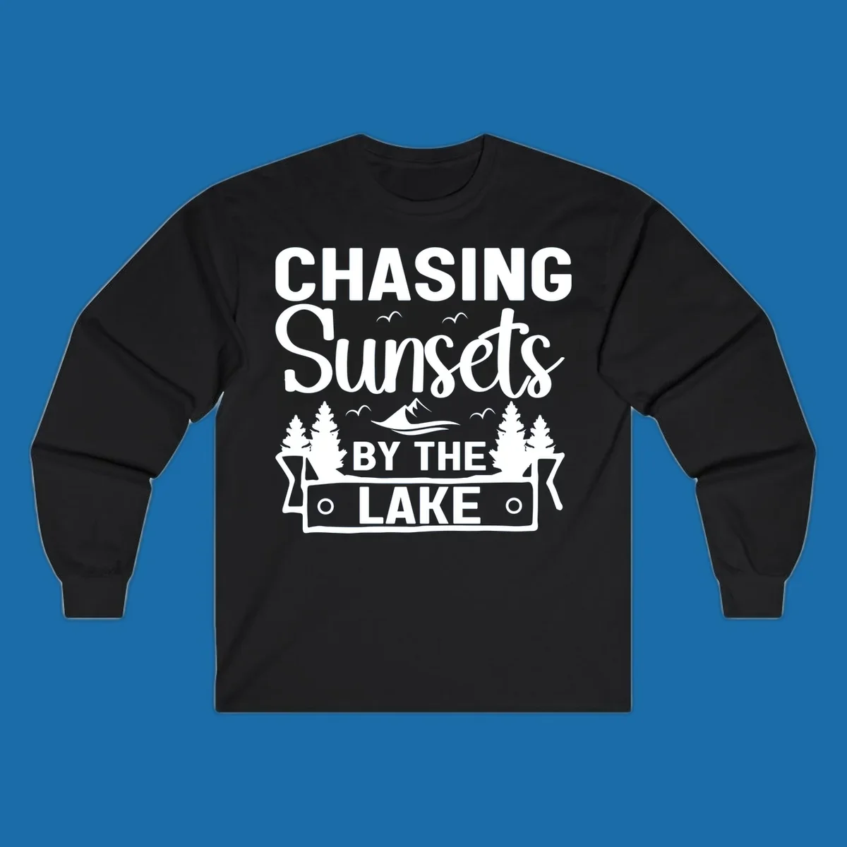 Chasing sunsets by the lake design with text, trees, mountains, and birds.
