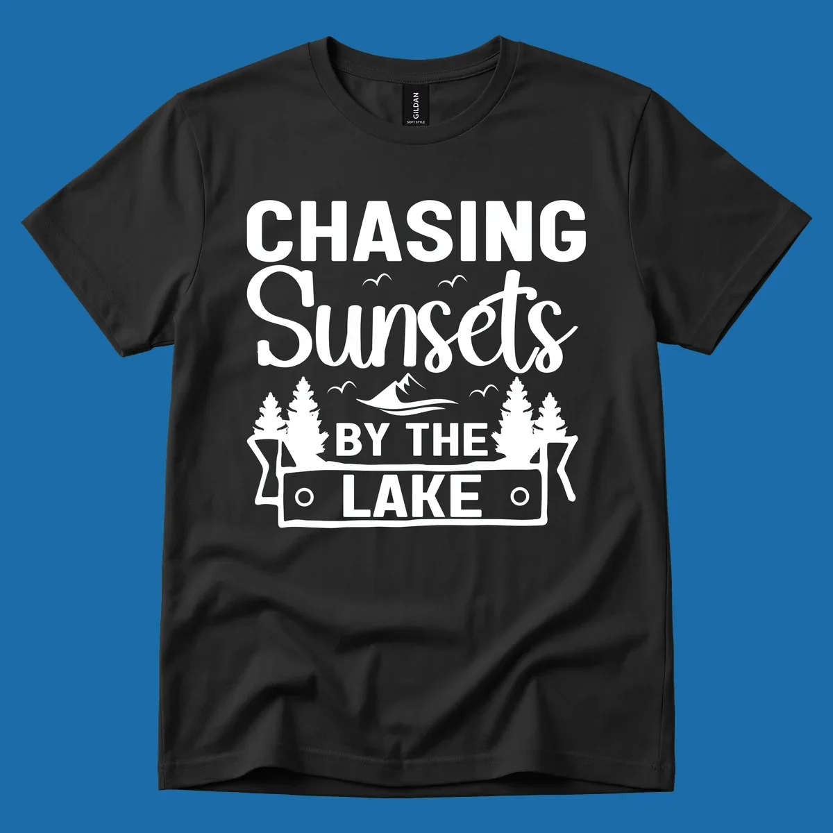 Chasing sunsets by the lake design with text, trees, mountains, and birds.