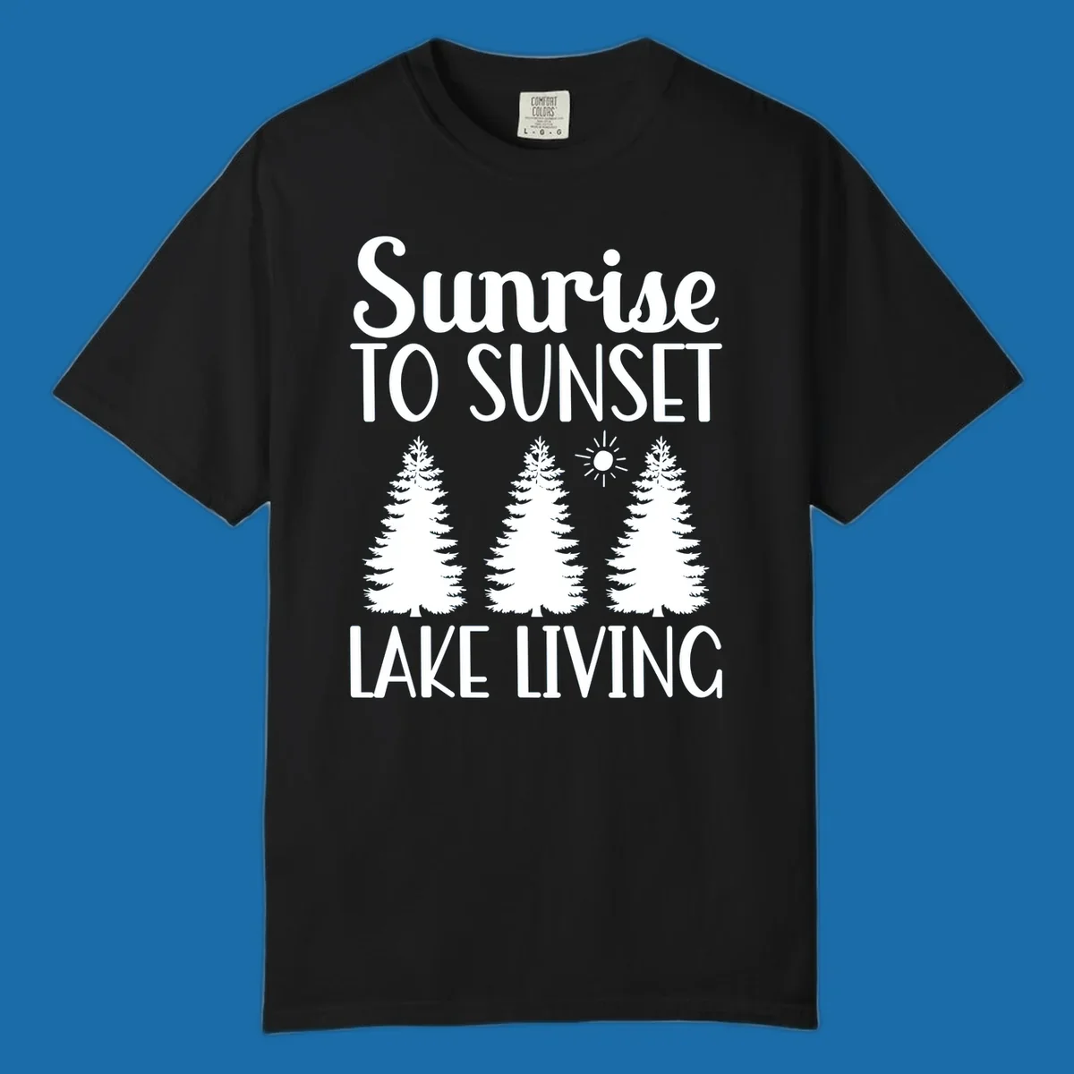 Sunrise to sunset lake living text with pine trees and sun graphic. lake-living-sunrise-sunset