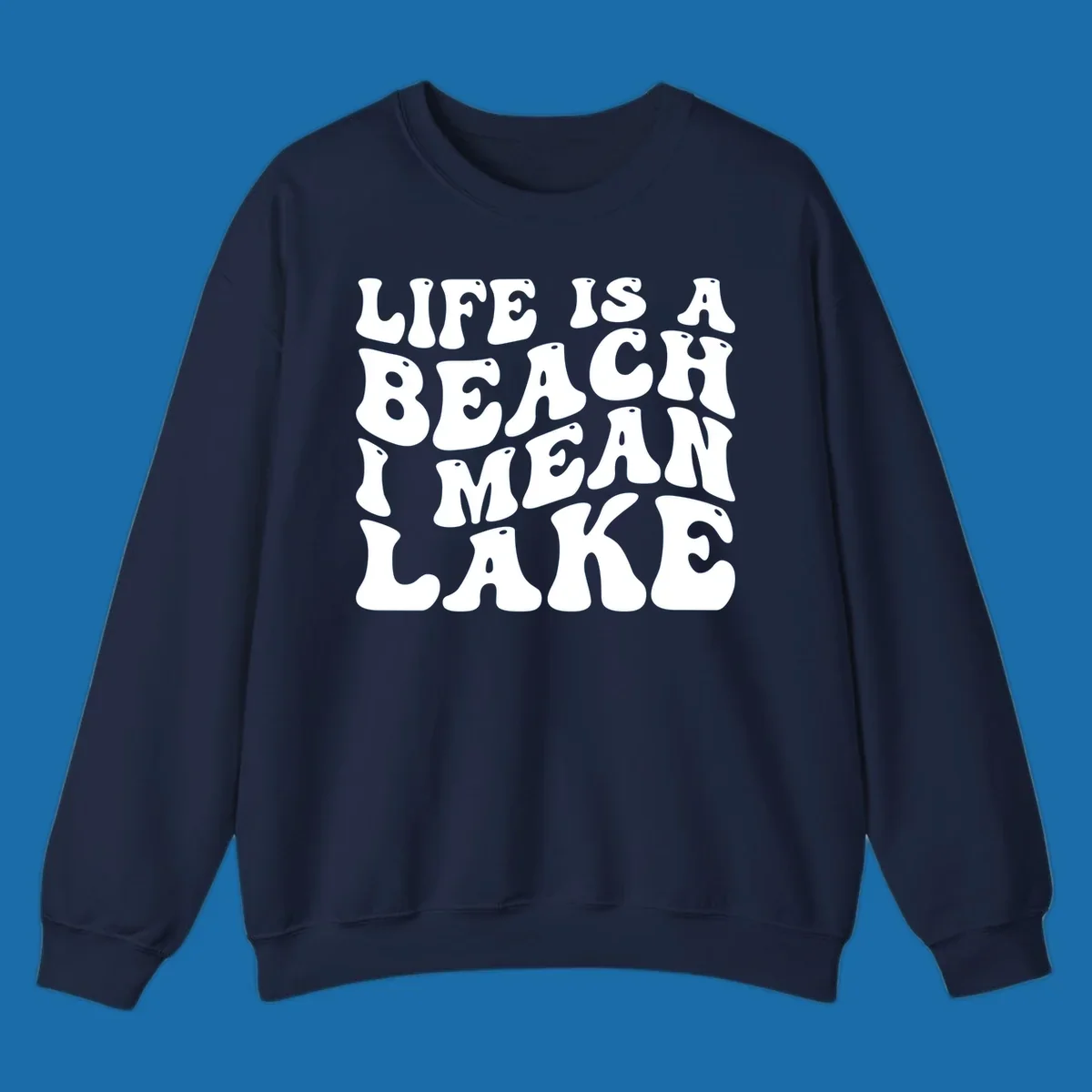 Retro typography design with the phrase "LIFE IS A BEACH I MEAN LAKE" for lake-themed apparel.