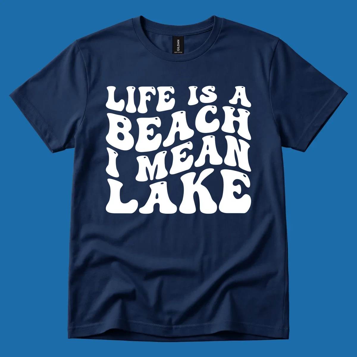 Retro typography design with the phrase "LIFE IS A BEACH I MEAN LAKE" for lake-themed apparel.
