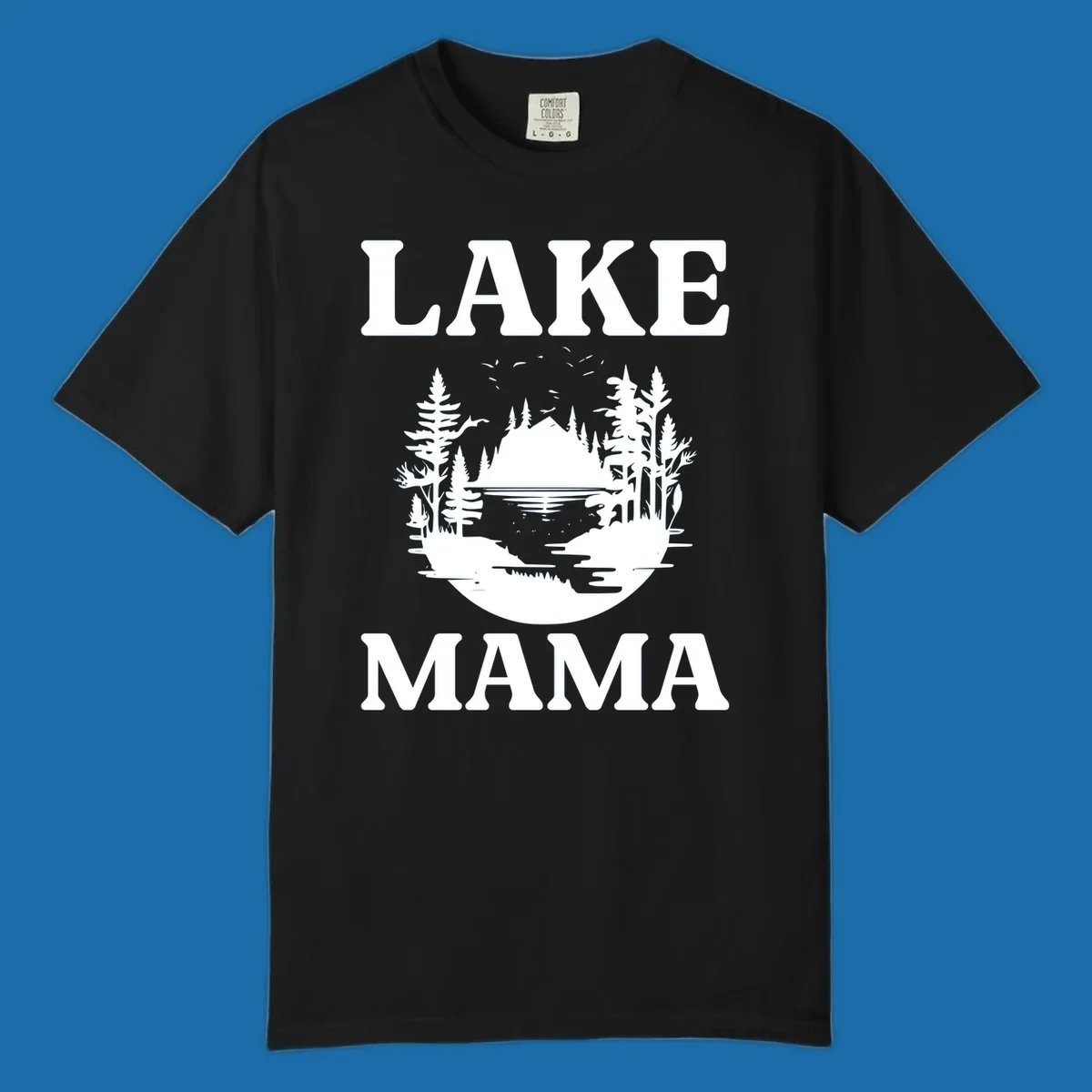Lake Mama nature scene with trees, lake, and mountains silhouette.