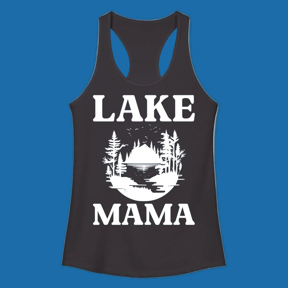 Lake Mama nature scene with trees, lake, and mountains silhouette.