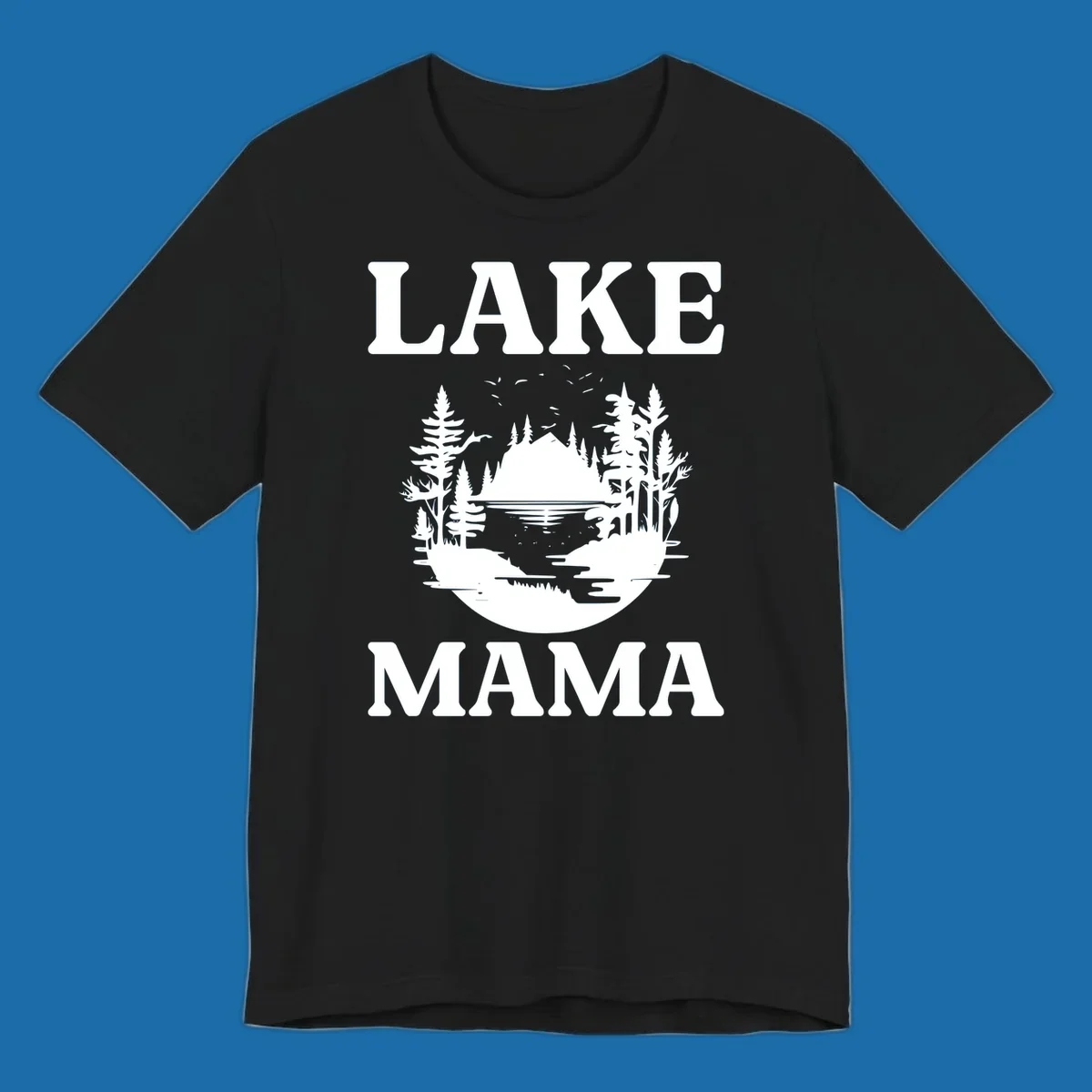 Lake Mama nature scene with trees, lake, and mountains silhouette.