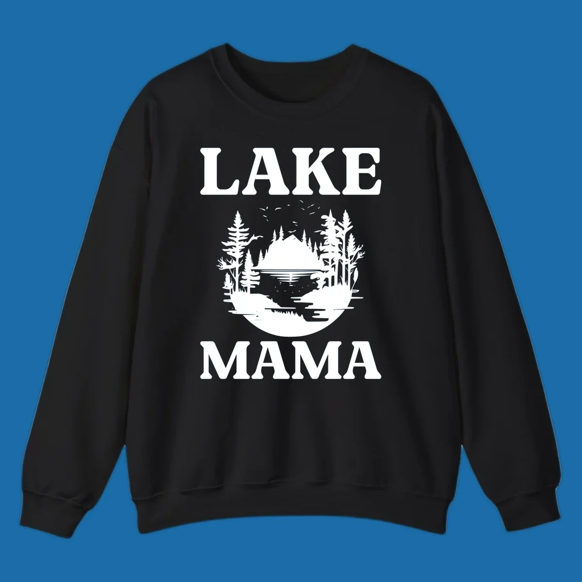 Lake Mama nature scene with trees, lake, and mountains silhouette.