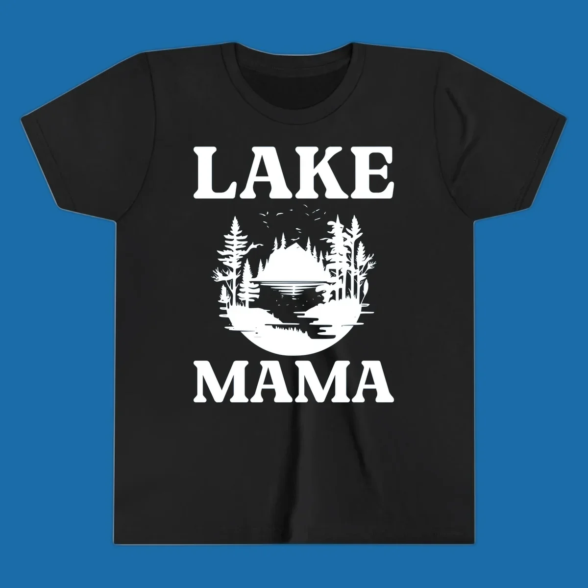 Lake Mama nature scene with trees, lake, and mountains silhouette.