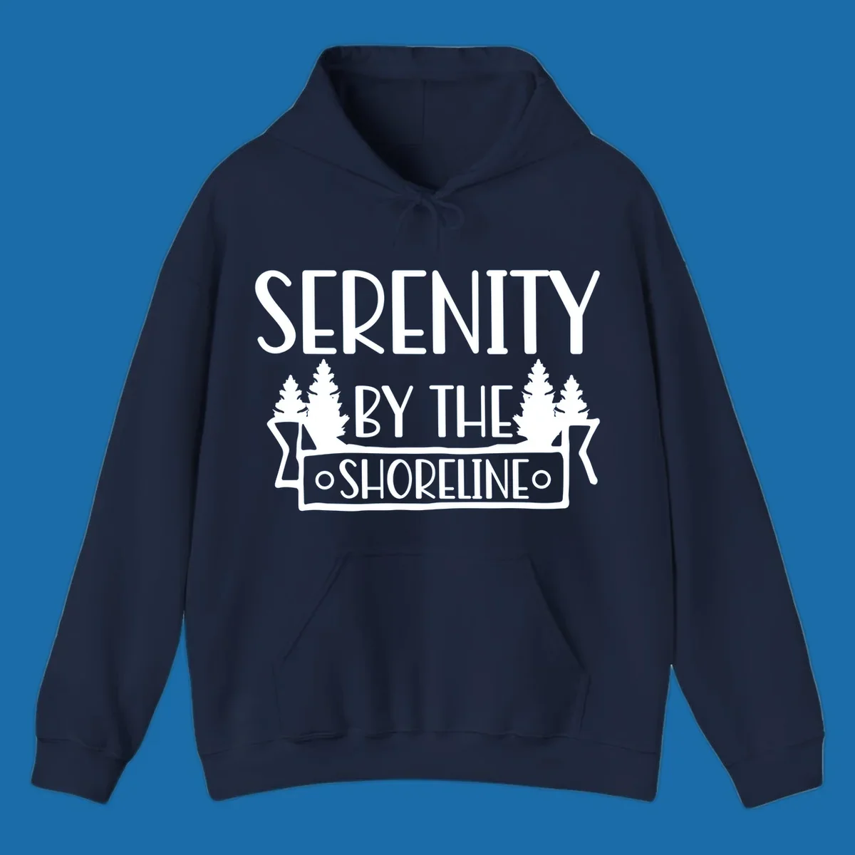 Serenity By The Shoreline text with pine trees and banner