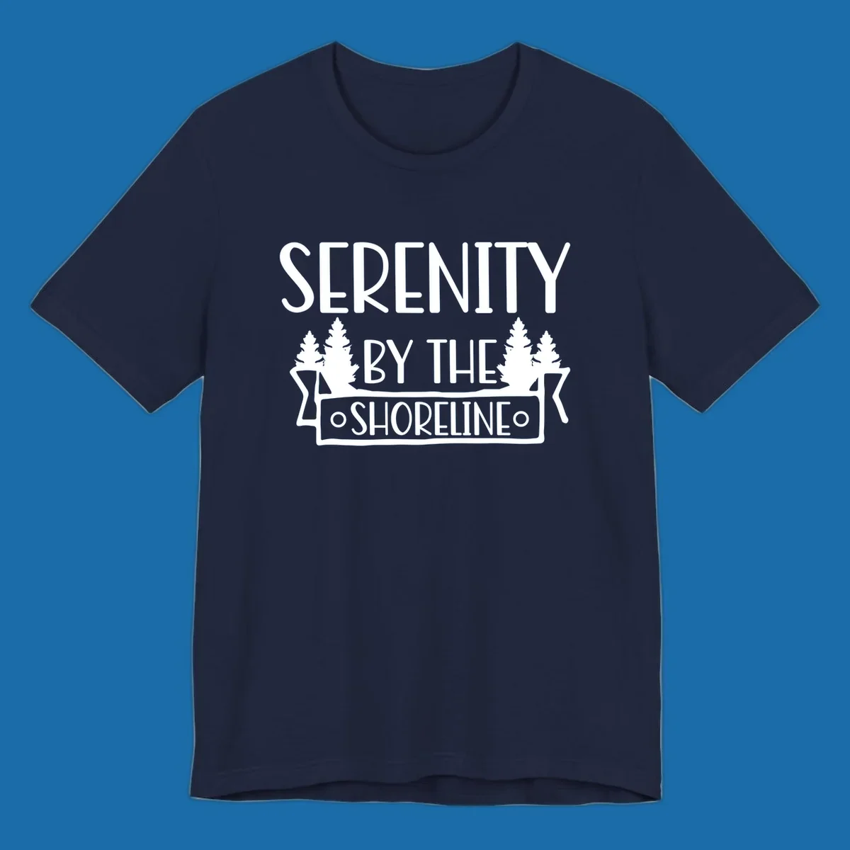 Serenity By The Shoreline text with pine trees and banner