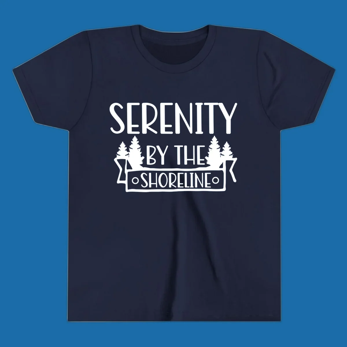 Serenity By The Shoreline text with pine trees and banner