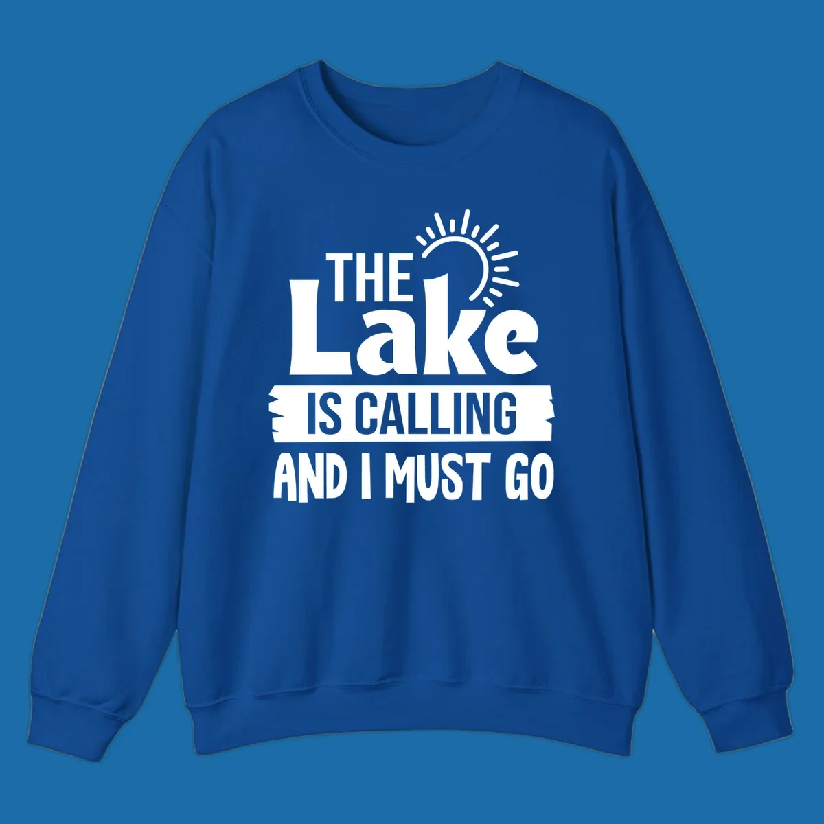 The Lake Is Calling And I Must Go text with a sun graphic. lake-calling-go