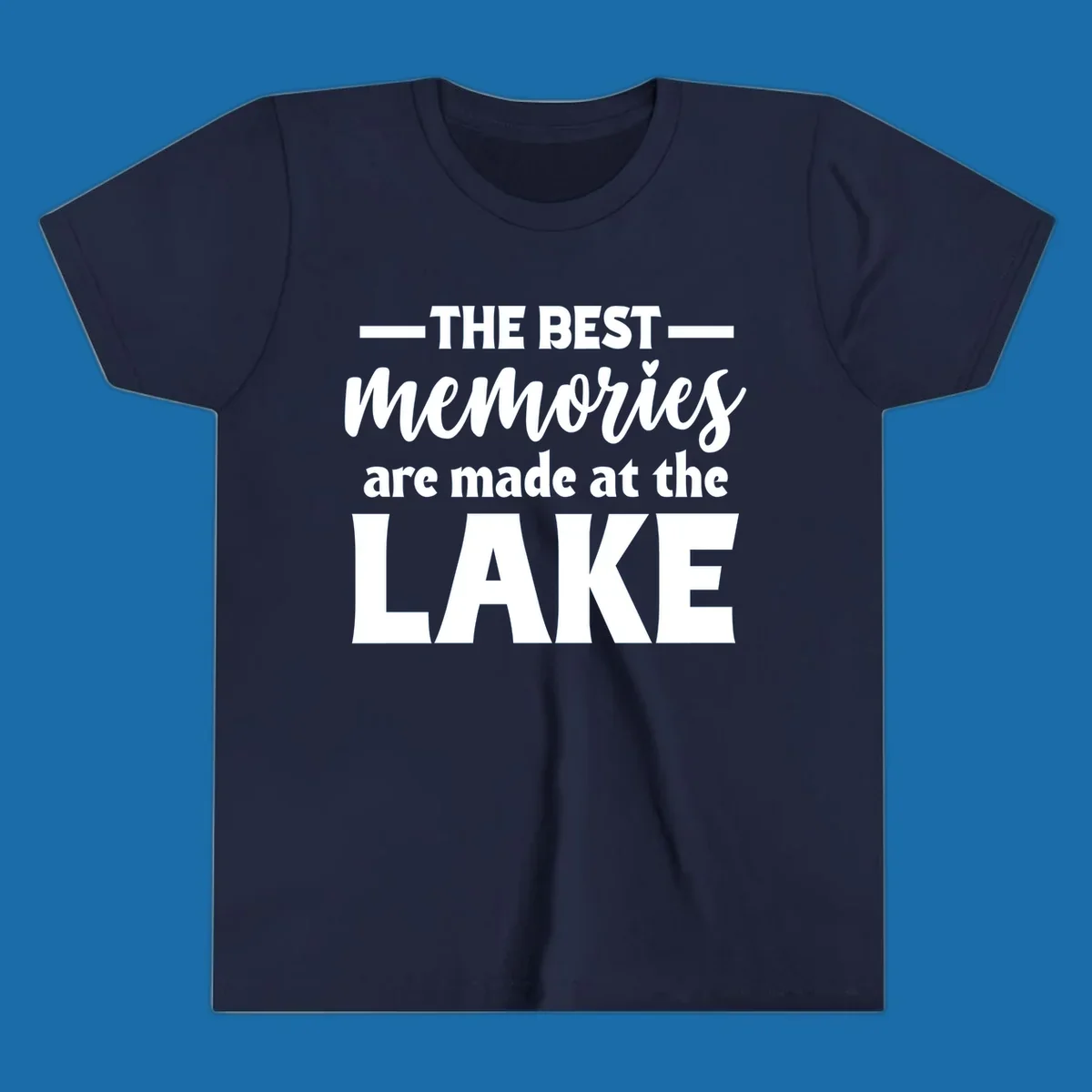 White typography design with the phrase 'THE BEST memories are made at the LAKE', featuring a heart accent.