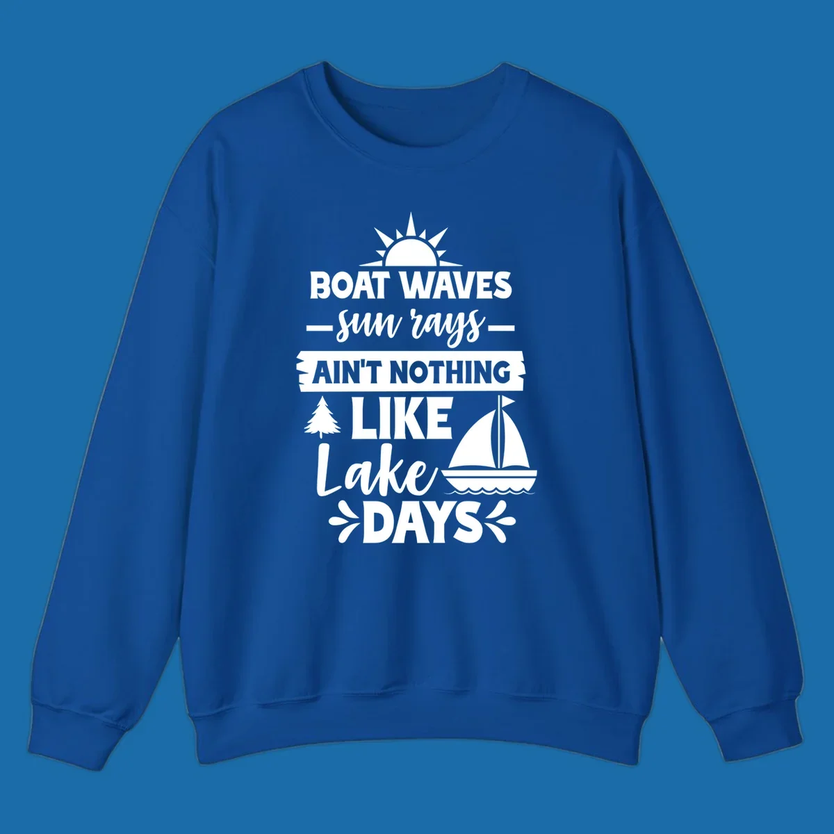 White text and graphics of sun rays, a sailboat, and a tree reading 'Boat Waves Sun Rays Ain't Nothing Like Lake Days'.