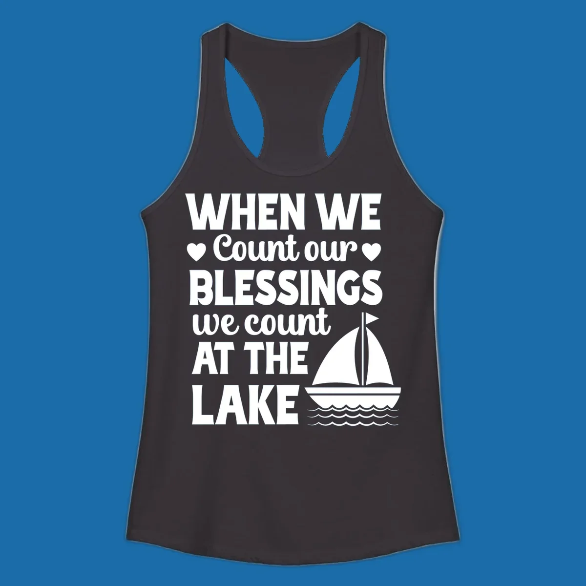 Text reads 'When We Count Our Blessings We Count At The Lake' with a sailboat graphic, lake-life-blessings design.