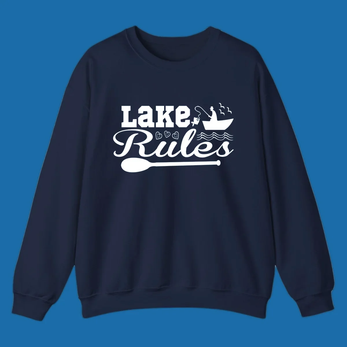 Lake Rules design with fishing boat, fish, oar, waves, and birds. White artwork on black and white backgrounds.