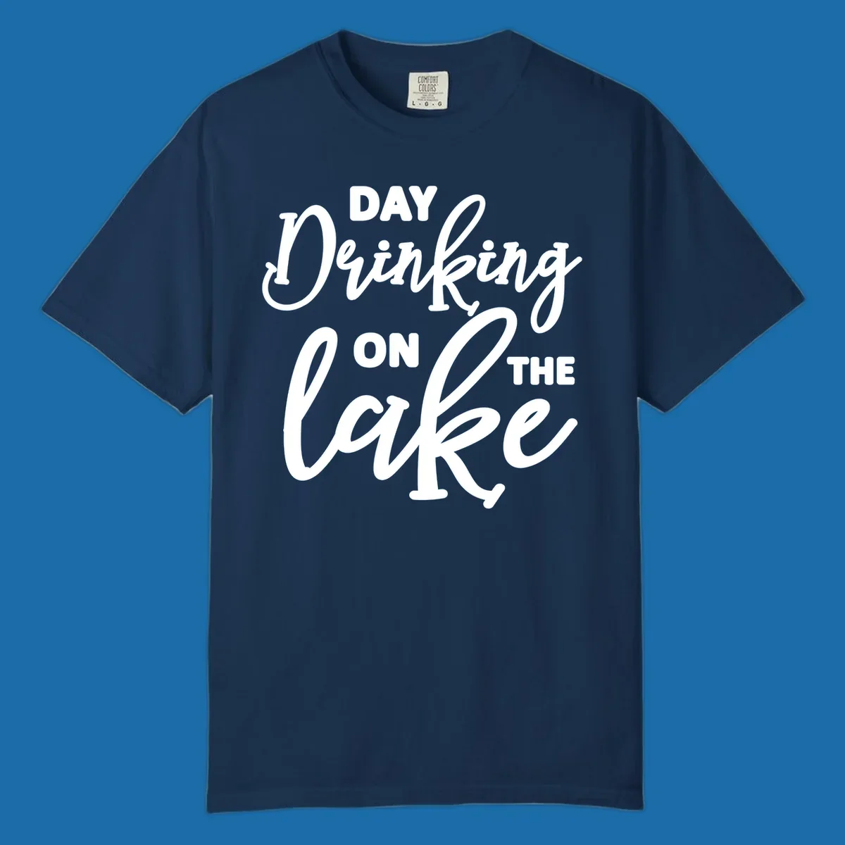 Typography design reading 'Day Drinking On The Lake' for lake day apparel.