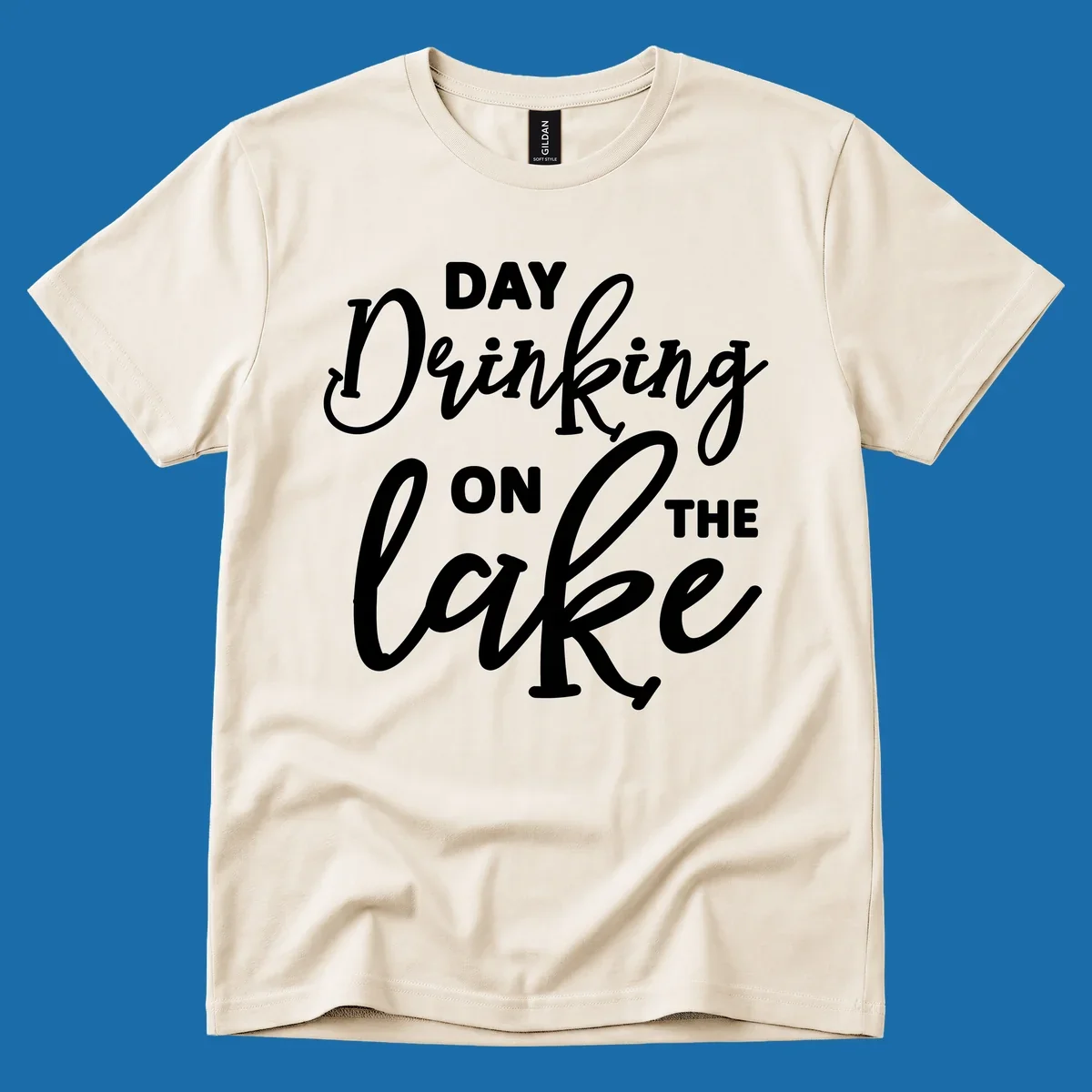 Typography design reading 'Day Drinking On The Lake' for lake day apparel.