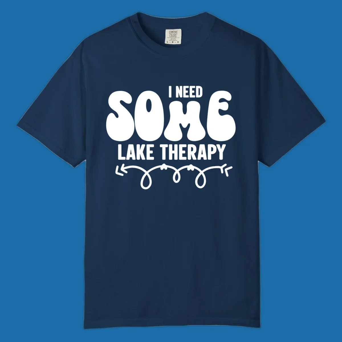 White "I Need Some Lake Therapy" text design with decorative wavy arrow line.