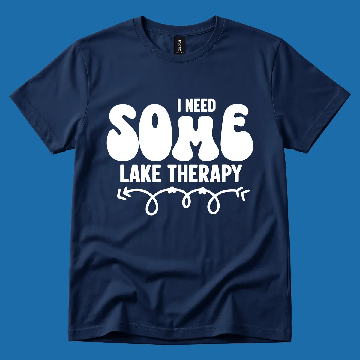 White "I Need Some Lake Therapy" text design with decorative wavy arrow line.