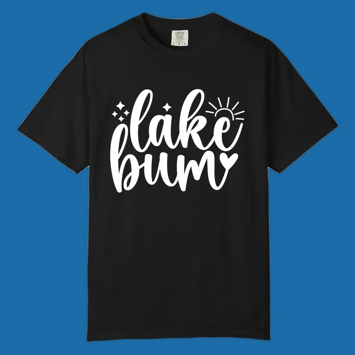 Lake bum text design with sun, sparkles, and heart graphic.