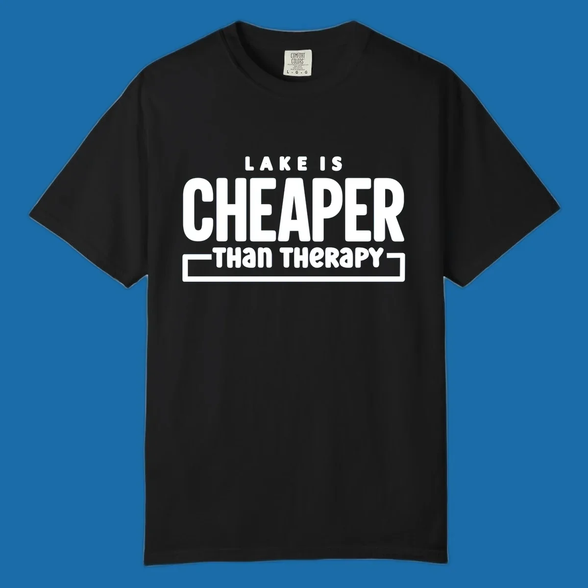 White text reads "LAKE IS CHEAPER THAN THERAPY", a humorous phrase about lake life.