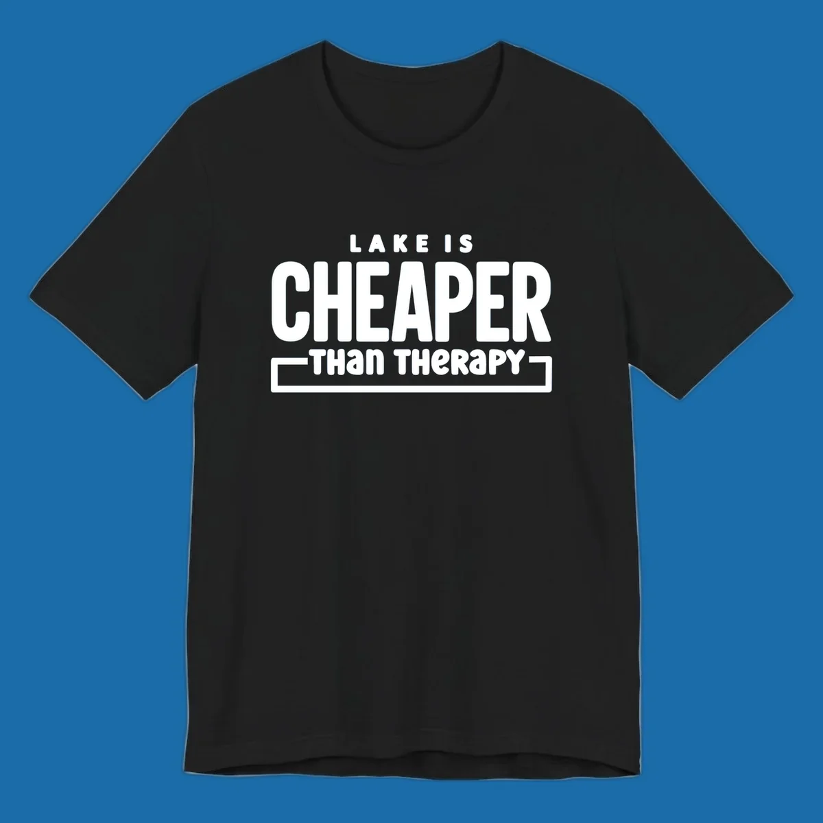 White text reads "LAKE IS CHEAPER THAN THERAPY", a humorous phrase about lake life.