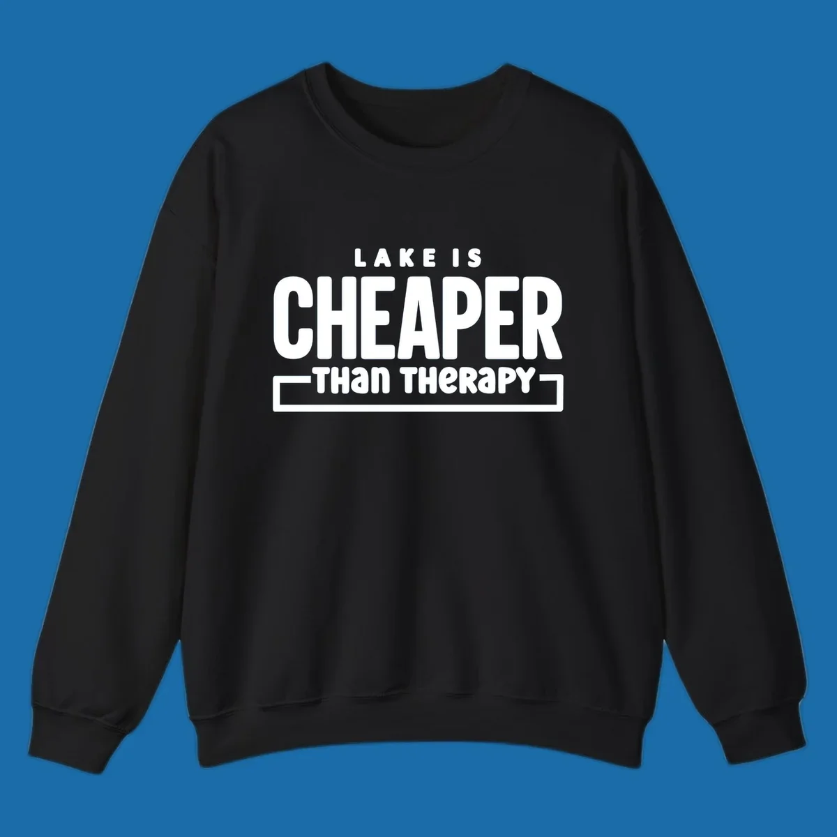 White text reads "LAKE IS CHEAPER THAN THERAPY", a humorous phrase about lake life.