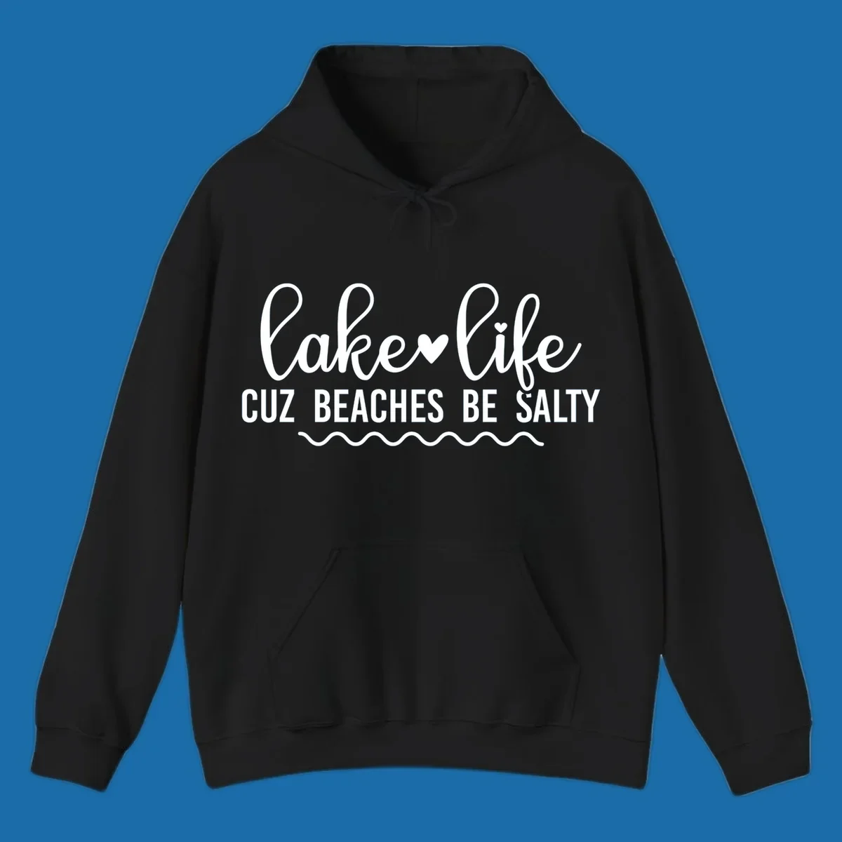 Lake life cuz beaches be salty text design with heart and wavy lines.