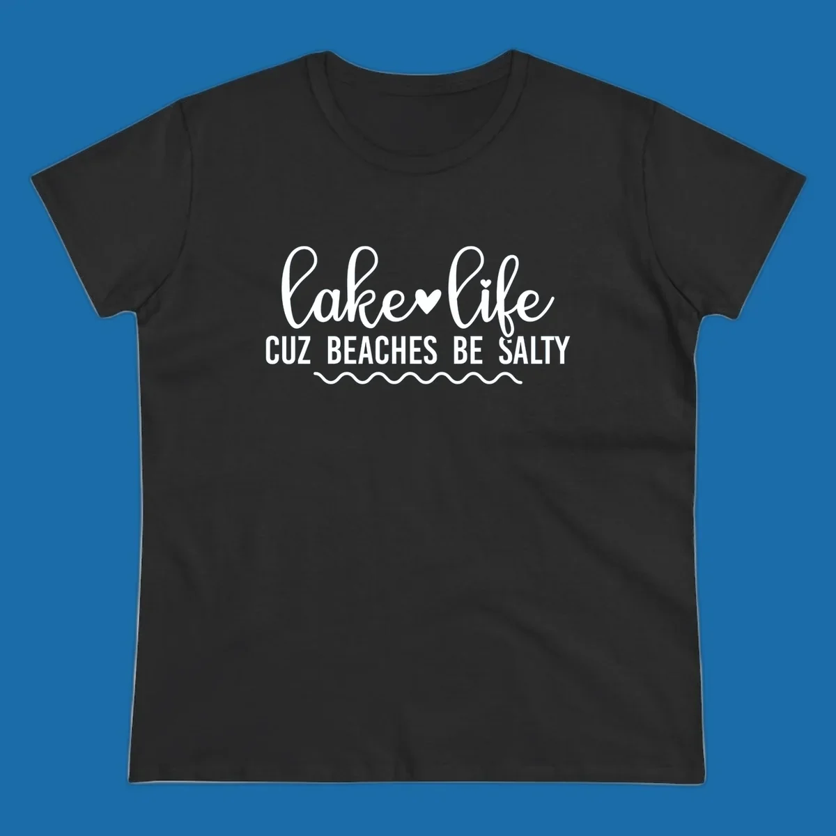 Lake life cuz beaches be salty text design with heart and wavy lines.