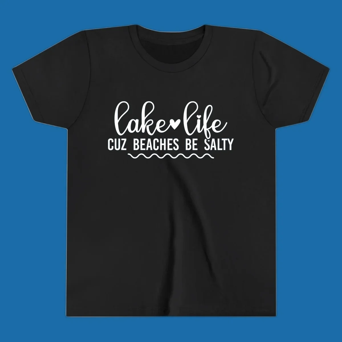 Lake life cuz beaches be salty text design with heart and wavy lines.
