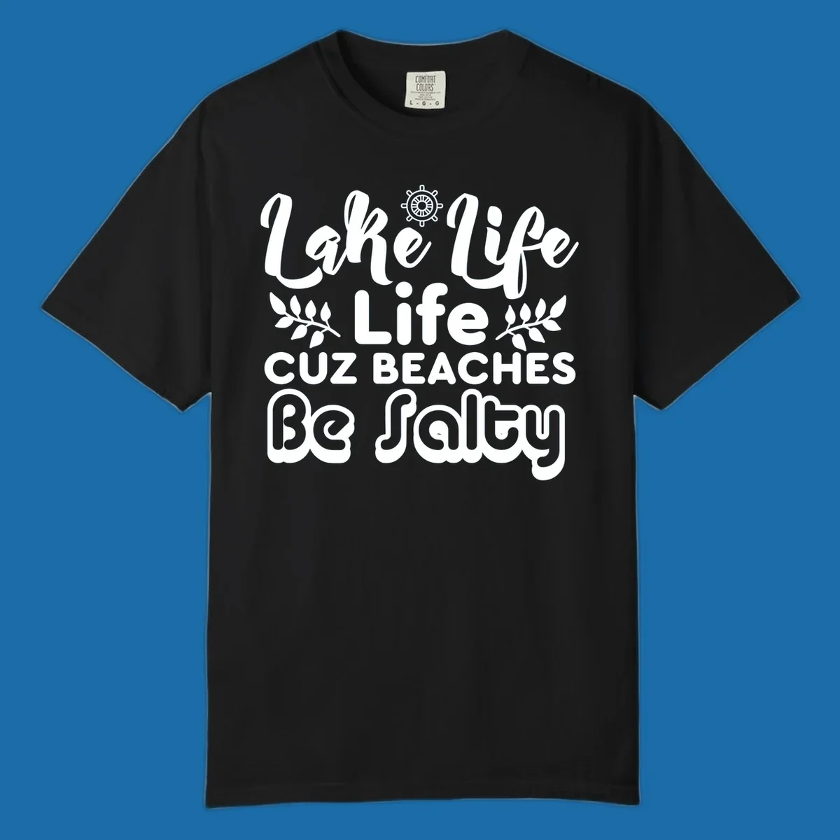 Lake Life Cuz Beaches Be Salty typography design with ship wheel and leaf accents.