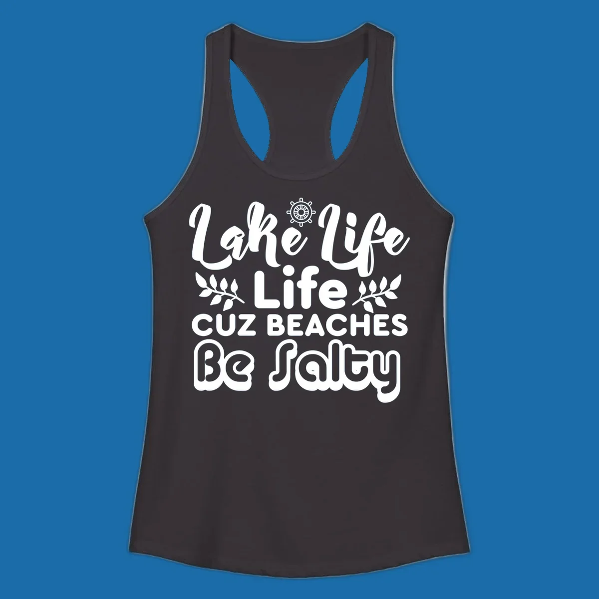 Lake Life Cuz Beaches Be Salty typography design with ship wheel and leaf accents.