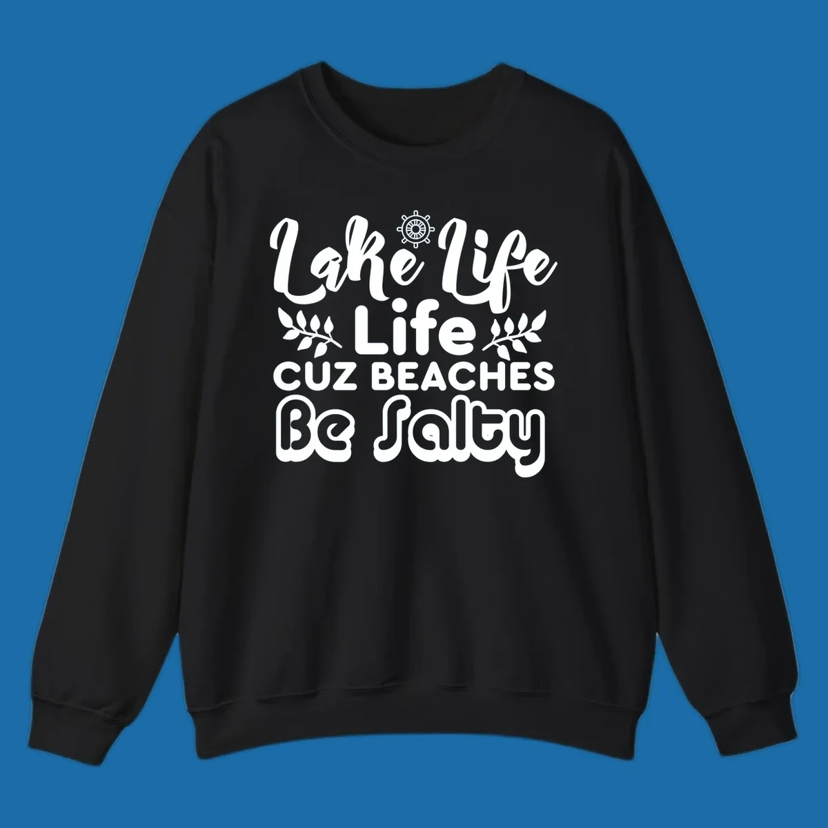Lake Life Cuz Beaches Be Salty typography design with ship wheel and leaf accents.