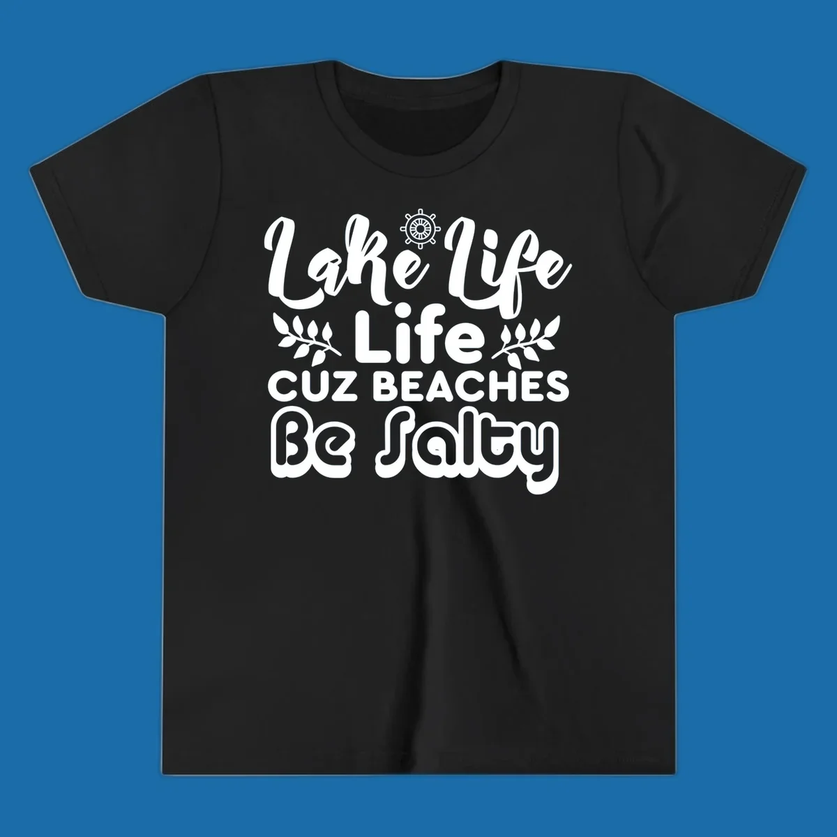 Lake Life Cuz Beaches Be Salty typography design with ship wheel and leaf accents.