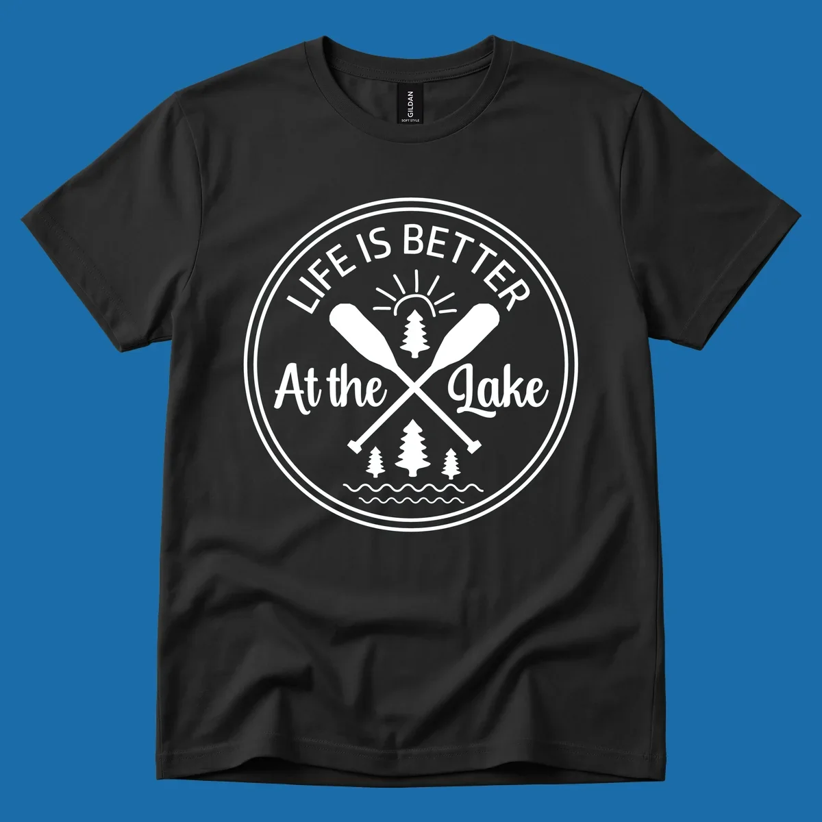 Life is better at the lake circular badge with oars, trees, sun, and waves.