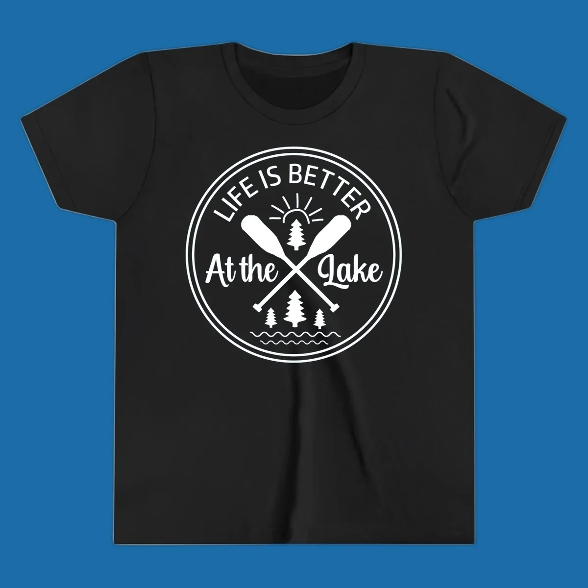 Life is better at the lake circular badge with oars, trees, sun, and waves.