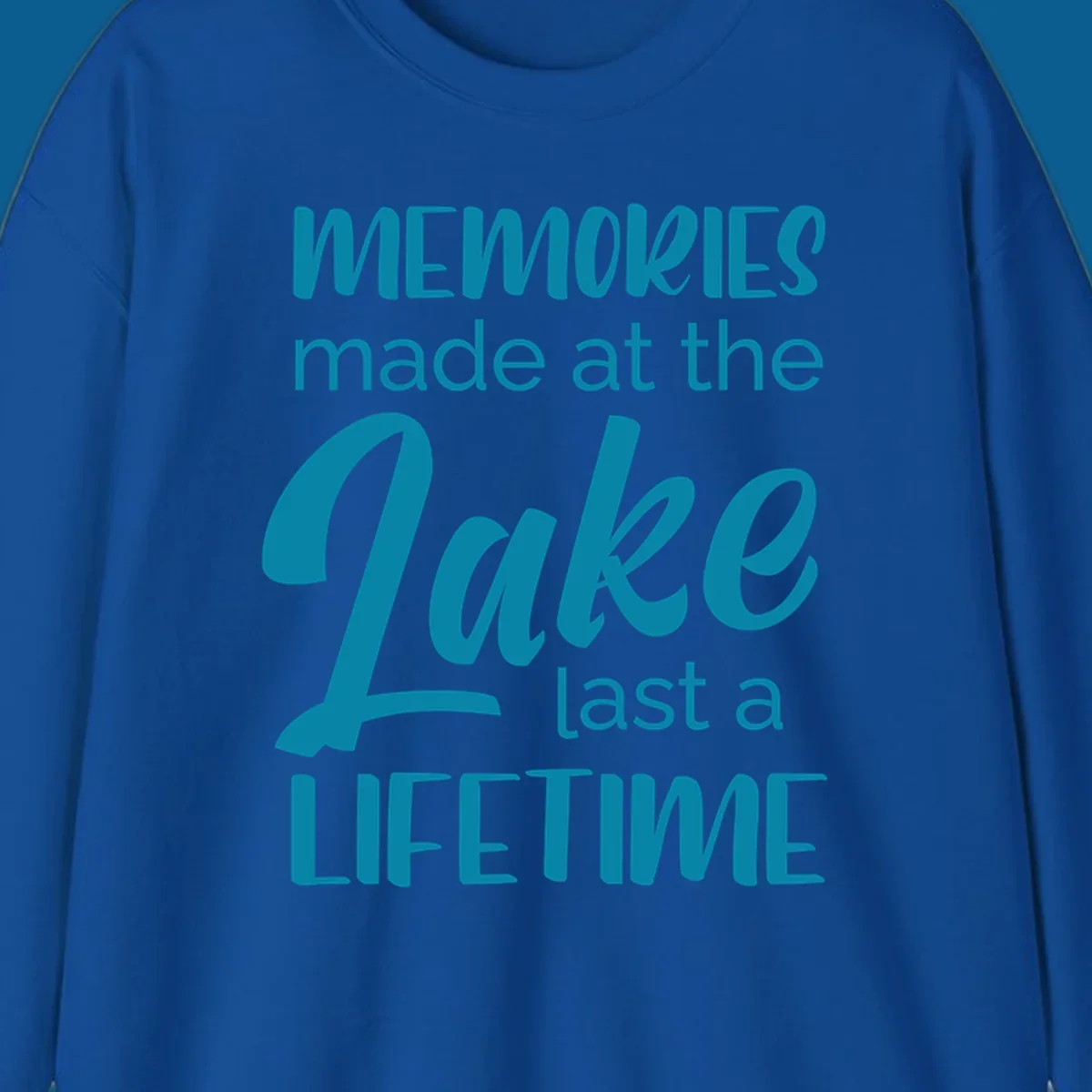 Typography design with the phrase "Memories made at the Lake last a Lifetime" in teal.