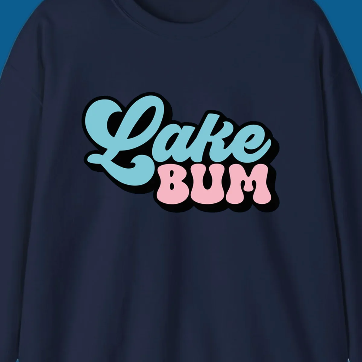 Retro script text design with 'Lake' in light blue and 'BUM' in pink, on a black background. Lake bum style.