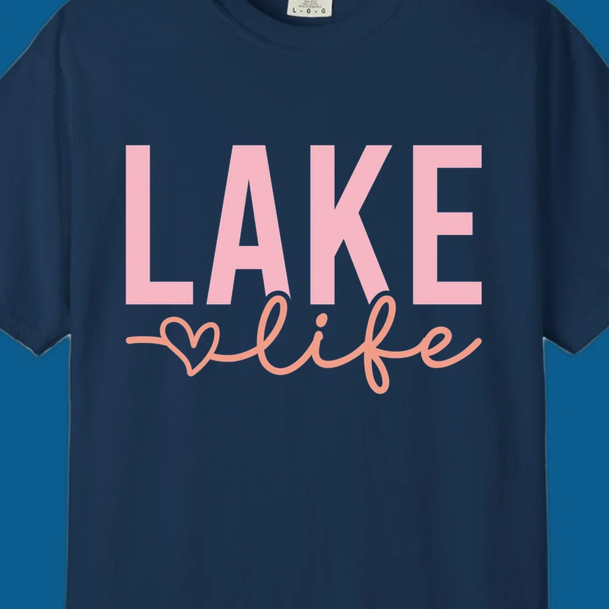 Lake life script design with pink letters and peach cursive text with a heart. lake-life-script