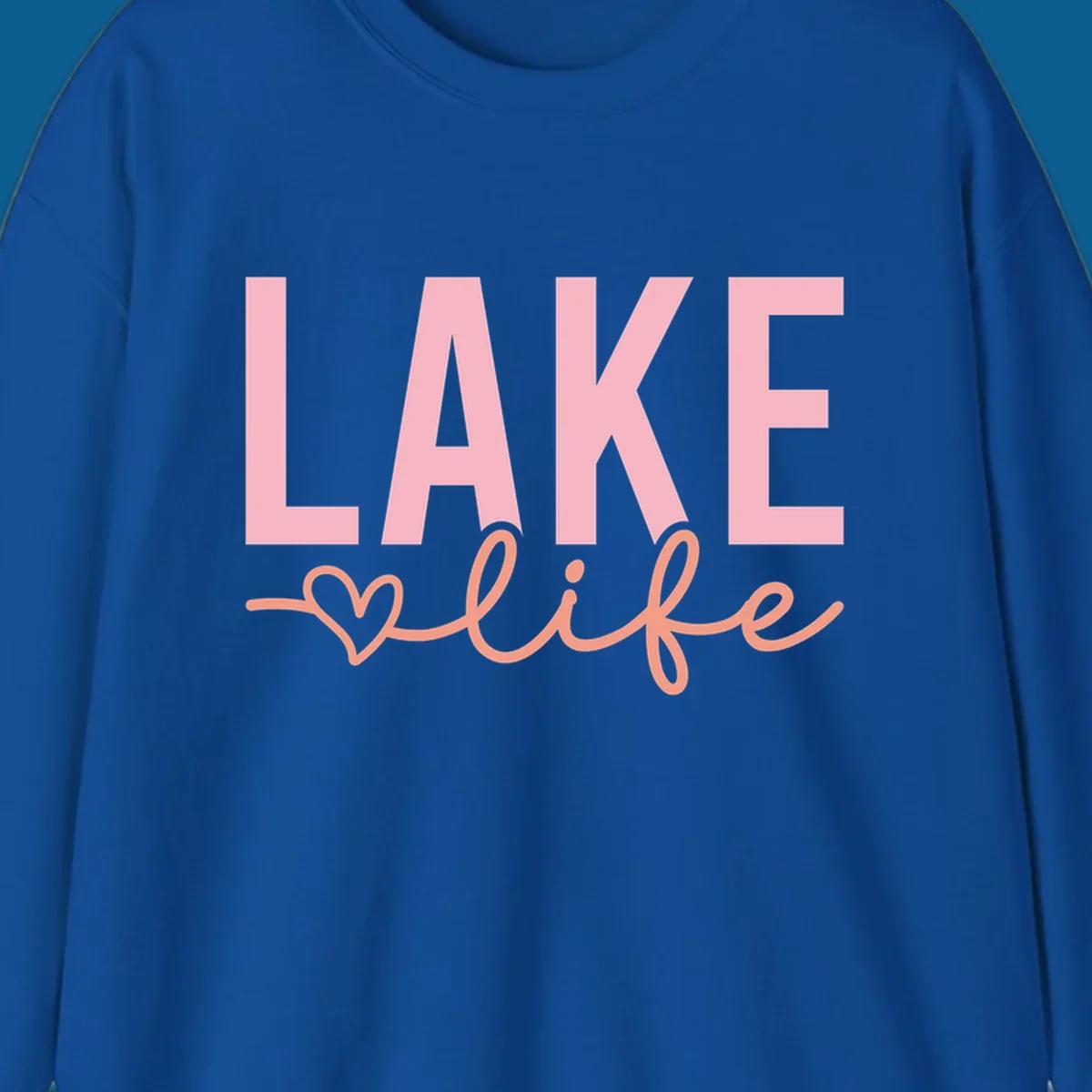 Lake life script design with pink letters and peach cursive text with a heart. lake-life-script