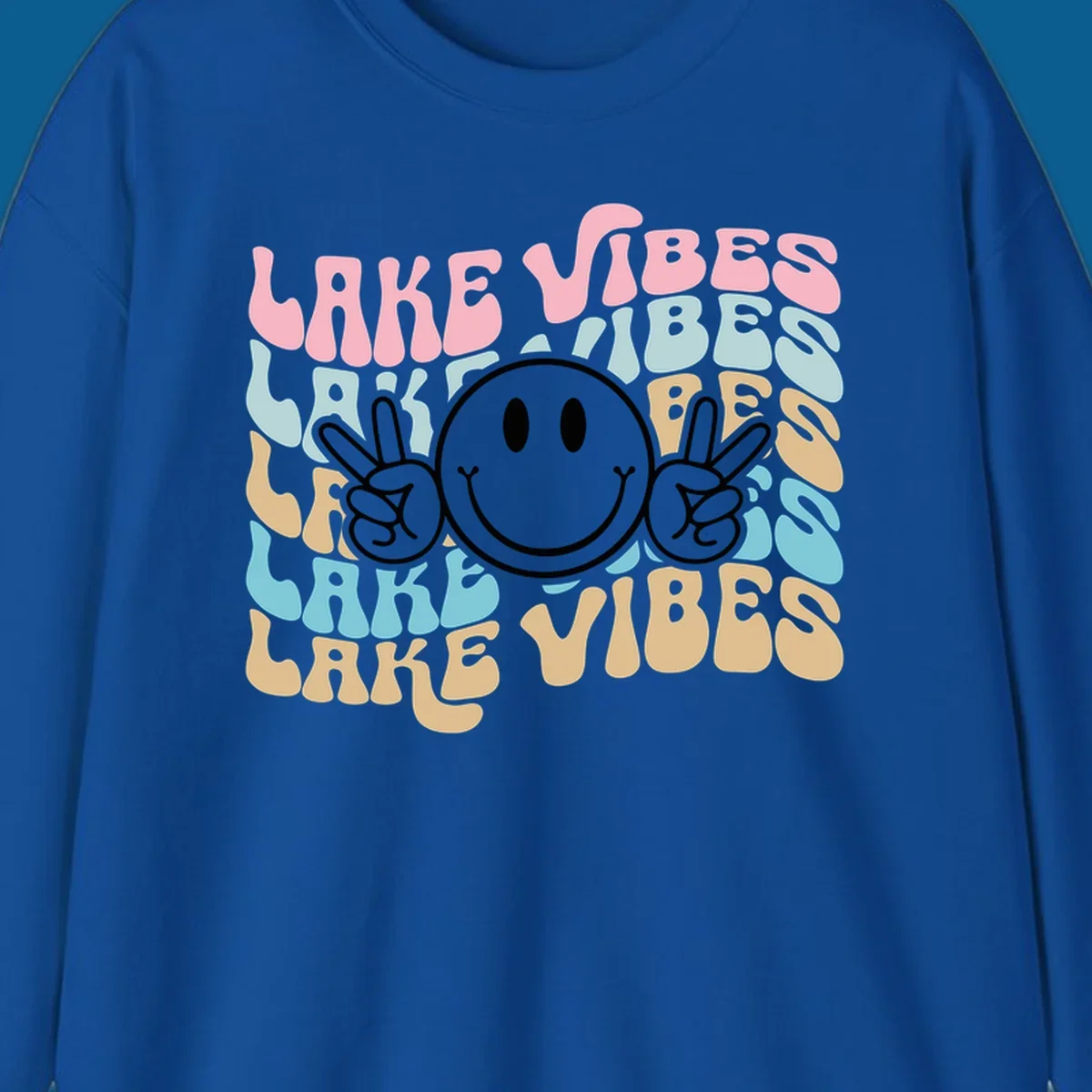 Retro lake vibes text with a black smiley face and peace signs.