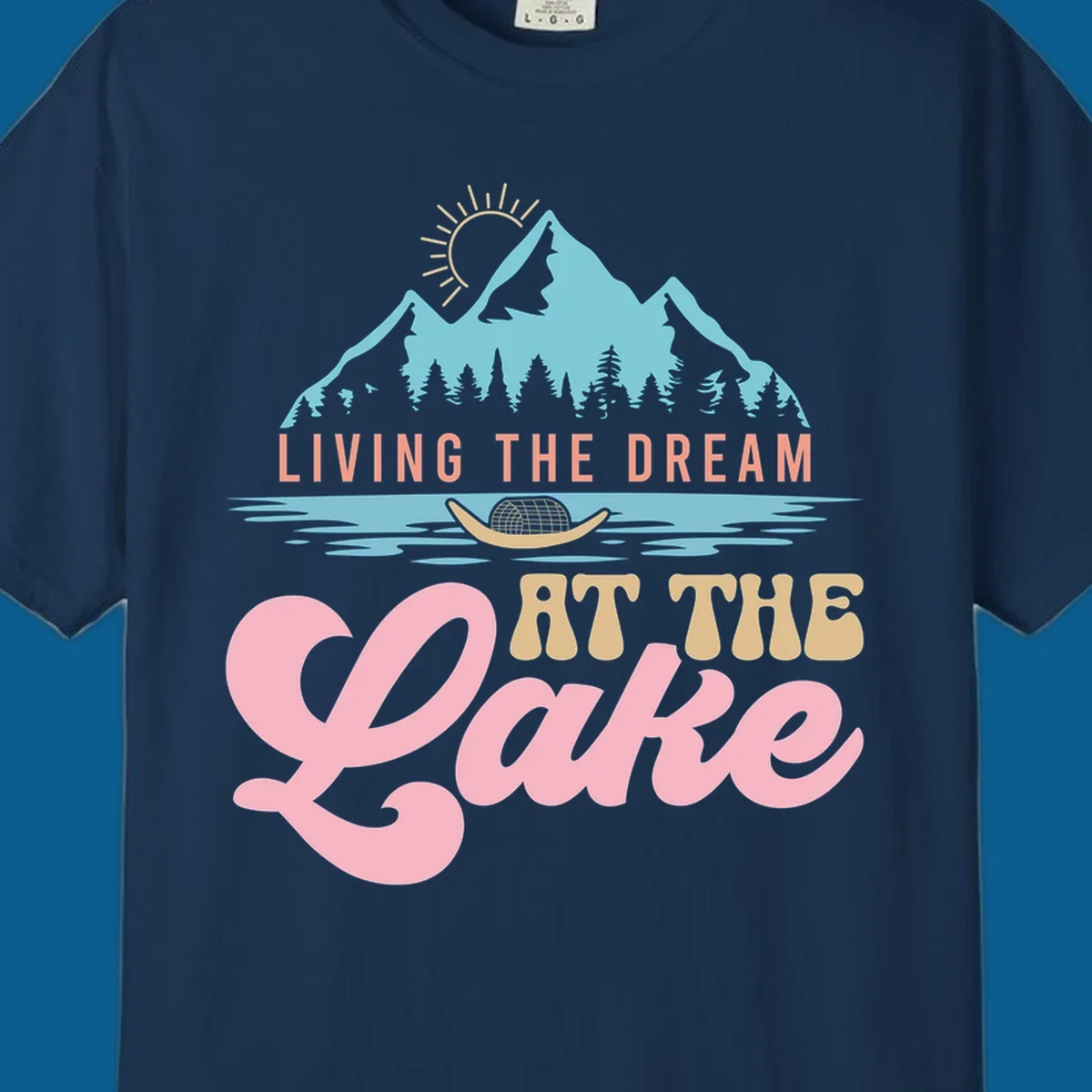 Illustration of mountains and lake with text 'Living The Dream At The Lake', representing the lake-life-dream concept.