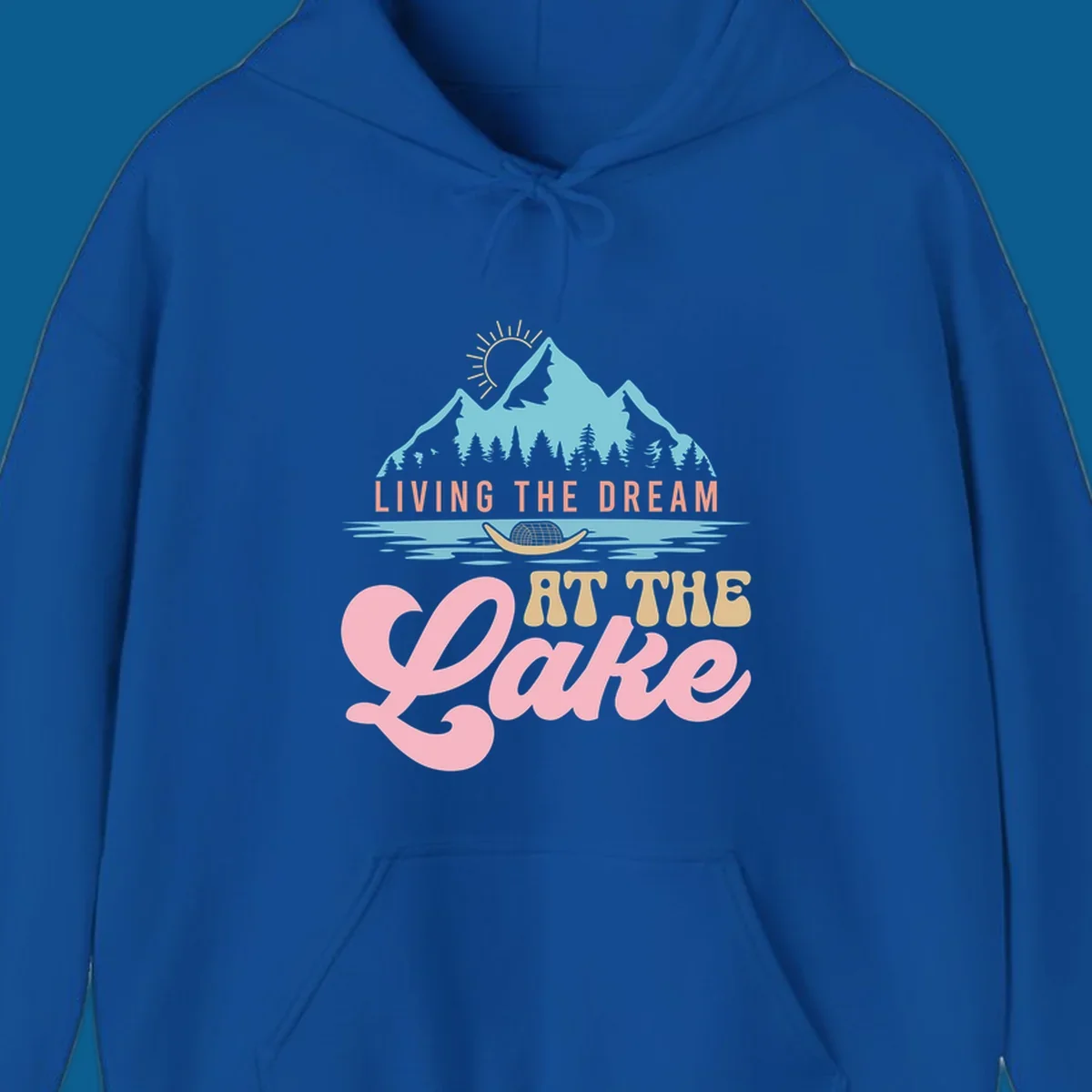 Illustration of mountains and lake with text 'Living The Dream At The Lake', representing the lake-life-dream concept.