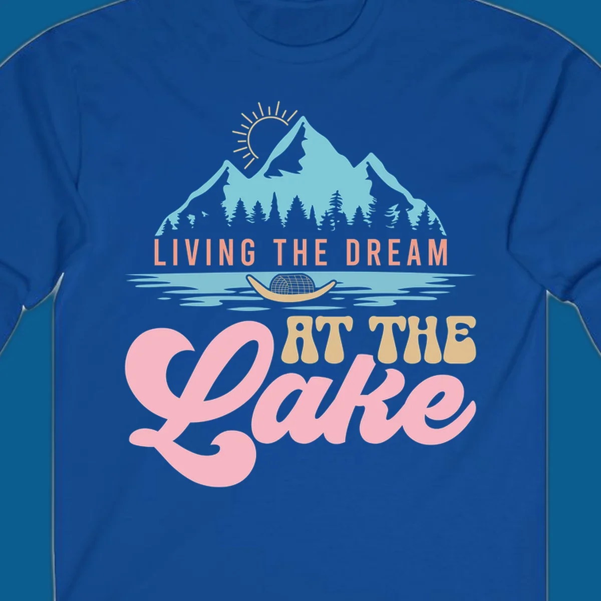 Illustration of mountains and lake with text 'Living The Dream At The Lake', representing the lake-life-dream concept.