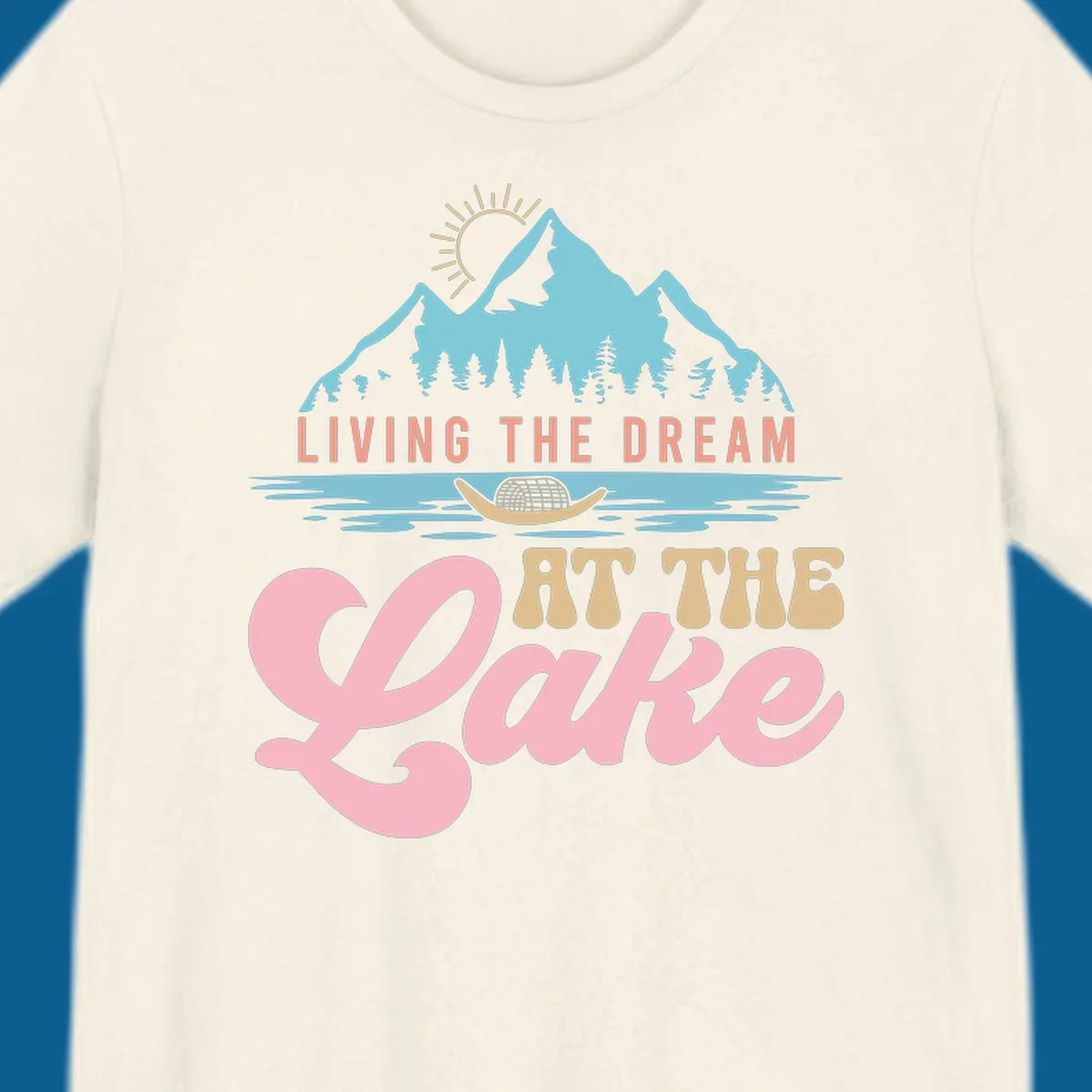 Illustration of mountains and lake with text 'Living The Dream At The Lake', representing the lake-life-dream concept.