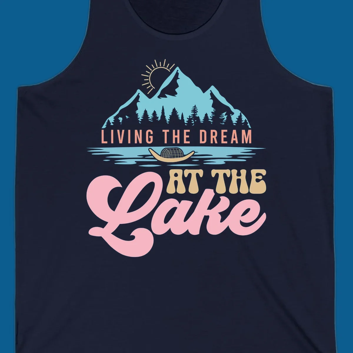 Illustration of mountains and lake with text 'Living The Dream At The Lake', representing the lake-life-dream concept.