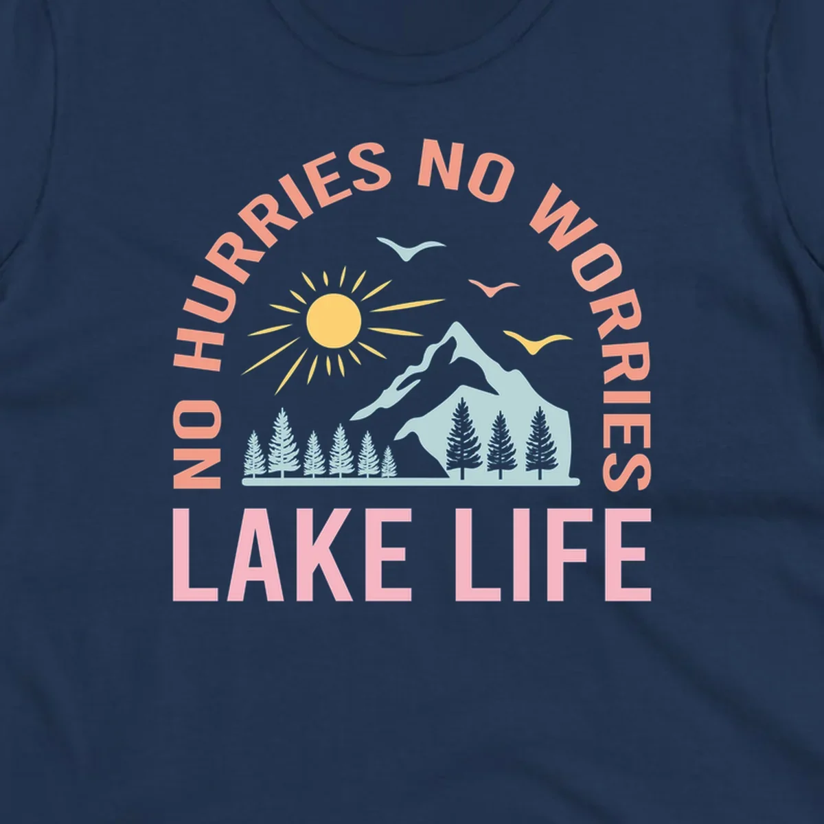 Lake life scenic design with mountains, sun, trees, and no worries text.